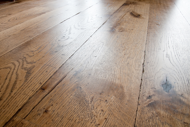 Reclaimed timber flooring effect. Tumbled, coloured and oiled Oak with an antique wood look.