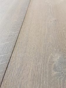 Dark grey flooring, fumed oak with tinted oil finish